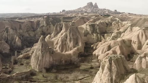 Aerial video of a panoramic view of natural rock formations in Cappadocia, Turkey