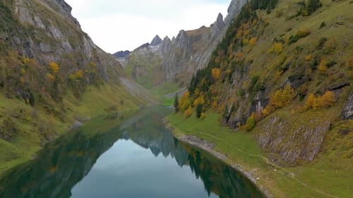 Serene Autumn Reflections on Falensee Lake in the Heart of the Swiss Alps