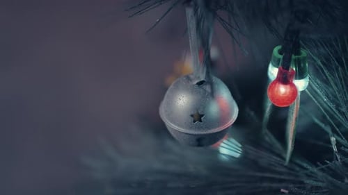 Silver Jingle Bell Ornament on Christmas Tree
