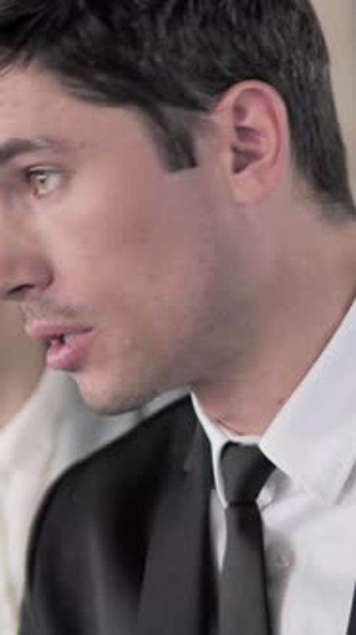 Business Man Talks to Colleague at Workplace