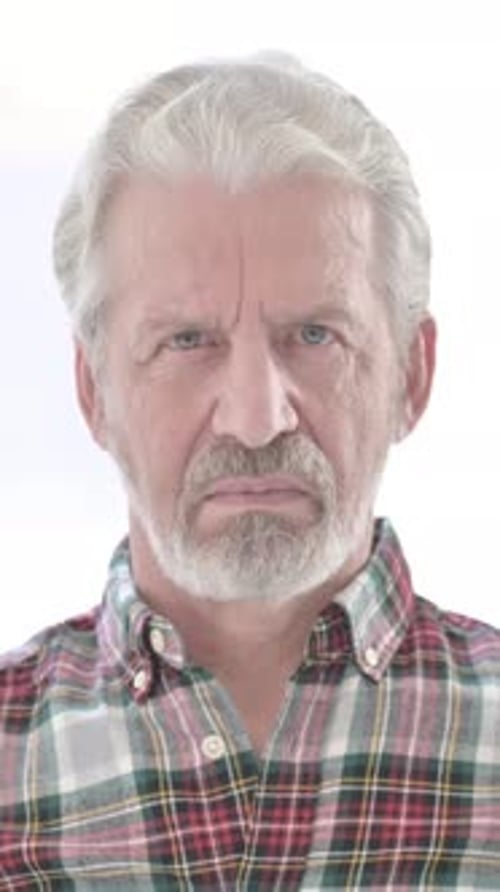 Serious Mature Man Stares Directly into the Camera