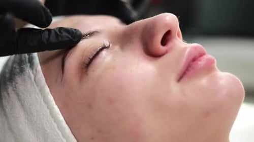 Woman Receiving a Rejuvenating Facial Massage