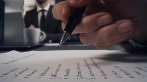 Hands of Businesswoman Proofreading List Printed on Paper