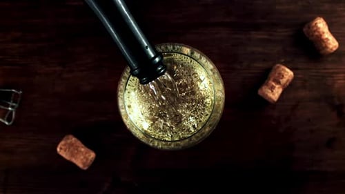 Champagne Poured Into Glass Overhead View