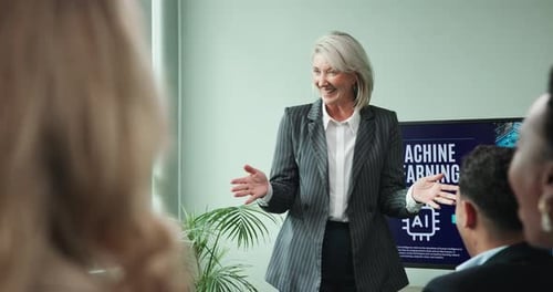 Businesswoman Presents Machine Learning Information at a Conference