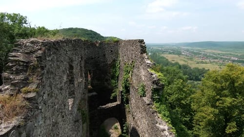 The Ancient Ruins Majestically Overlook a Beautiful and Scenic Valley in the Afternoon Light