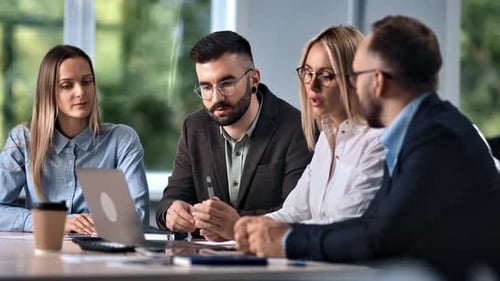 Business Team Meeting in Modern Office