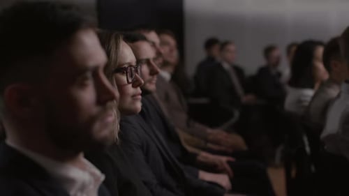 Audience listens attentively at a business conference