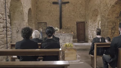 Mourners at funeral service in church