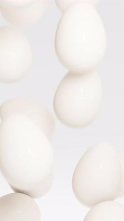 White Easter Eggs Fall Down and Fill Up the Screen 3d Render Animation Vertical Video