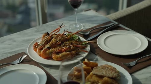 Sweet couple in love having romantic dinner at skyscraper rooftop restaurant bar