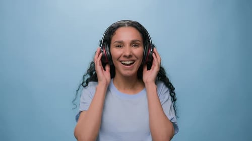 Woman Listening to Music with Headphones Dancing