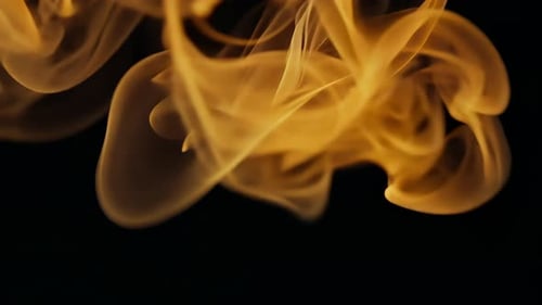 The Elegant Flames Are Dancing Gracefully Against a Dark and Mysterious Background