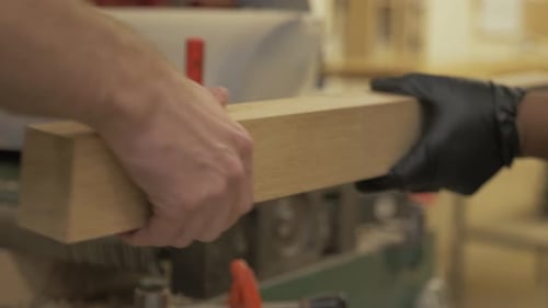People Work With Wood In Woodshop