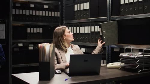 Woman Working With Laptop, Smiles At Files