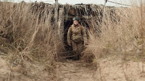 Female Soldier Emerging From a Military Bunker in a Combat Zone, Military Stock Footage ft. female soldier & bunker - Envato