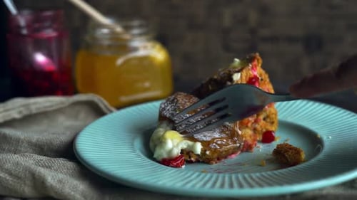 Delicious Slice of Cake Being Cut with Fork