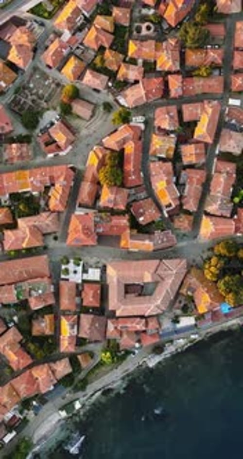 Aerial drone view of the old town Nessebar, Bulgaria at sunset. Vertical