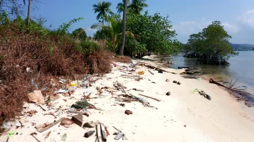 Aerial drone footage showing plastic debris pollution on a beach in Cambodia.