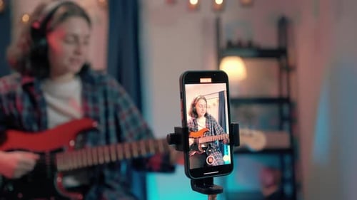 Young Adult Singing and Playing Electric Guitar