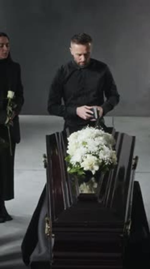 Priest Holding Traditional Funeral Ceremony Indoors