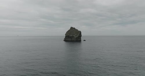 Aerial view of a rock in the sea, Iceland.