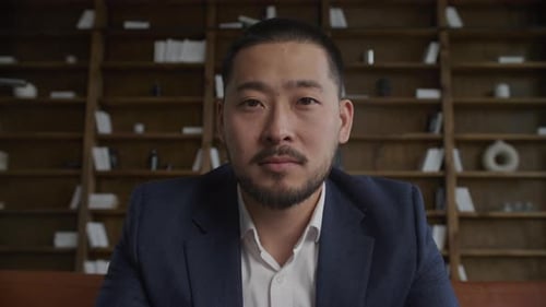 Businessman Looking at Camera Portrait in Office