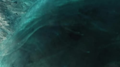 Glimmering Abstract Liquid Swirls in Blue and White