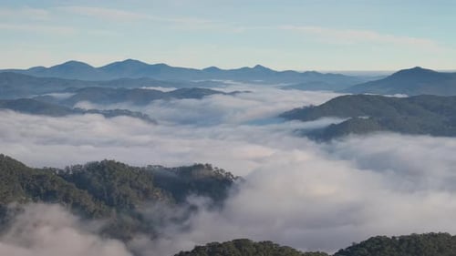 Landscape of misty valley and mountain clouds sea