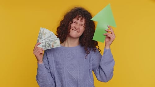Woman Holds Money and Upward Pointing Arrow
