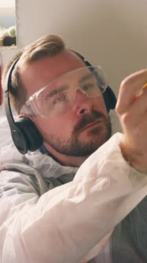 Man with headphones works on a project