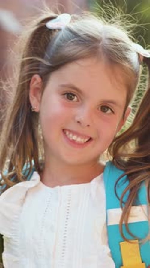 Headshot Portrait of Smiling Little Girl Looking at Camera Happy Small Elementary School Pupil Face