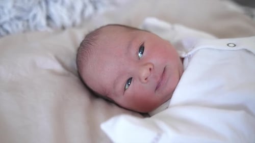 Cute Newborn Baby Lying on Blanket