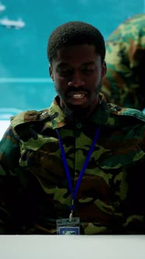 Vertical Video Army Personnel in a High Tech Command Center Attends a Videocall Meeting