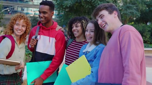 Diverse Group of Teenage Student Friends Standing Together at Campus College