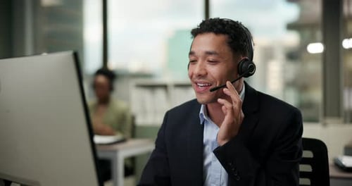 Talking, happy and man in call center office for customer service, consulting and business crm