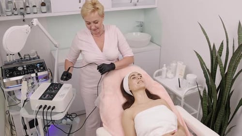 Woman Receiving Facial Treatment in Bright Medspa