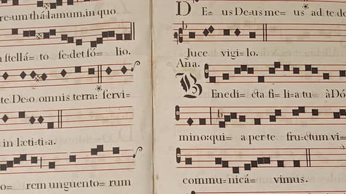 Old Book with Musical Notation Close-Up