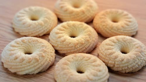 Delicious Ring Cookies on Wooden Surface