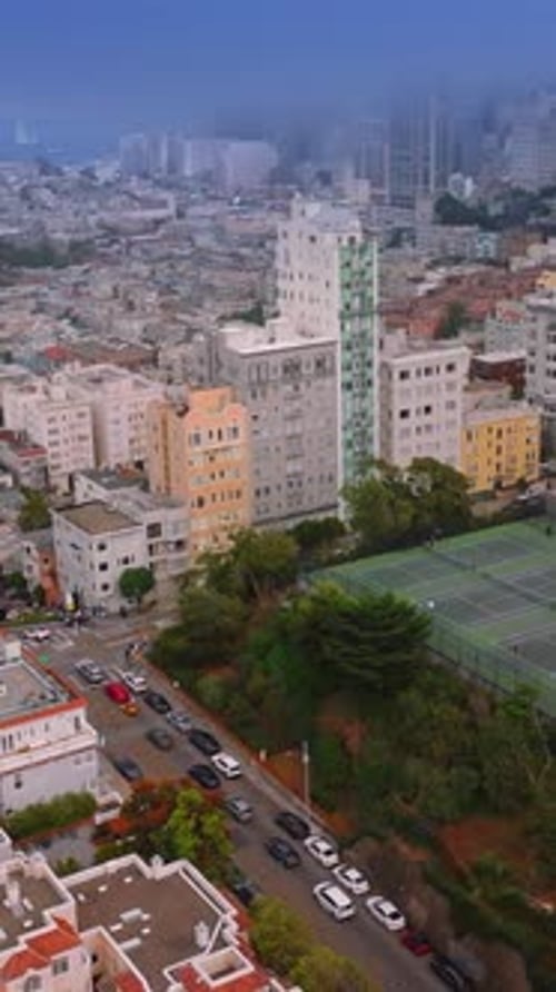 Mist covering the city panorama. Dense urban panorama of beautiful San Francisco from aerial view