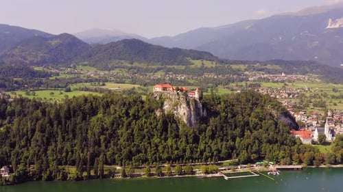 Aerial footage of Medieval Bled Castle overlooking the lake, Slovenia.