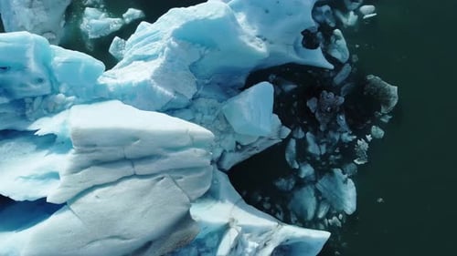 Iceberg in the Ocean Huge Chunks of Blue Ice Floating on the Waves Arctic Landscape Aerial View