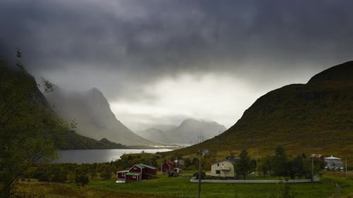 View of the settlement on a cold windy day in the mountains where the rain clouds conquer the lake i