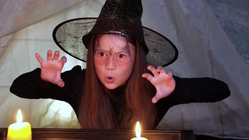 Girl in Witch Costume Casting Spells