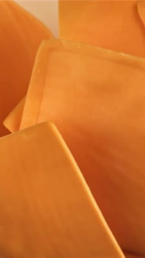 Slices of Cheddar Cheese Fly and Fall Filmed on a Highspeed Camera at 1000 Fps