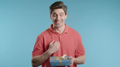 Excited Man Hold Gift Box With Bow He Is Happy And Flattered By Attention Guy