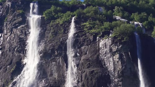 Three of the seven streams of the Seven Sisters waterfall in Geiranger fjord, Norway. Turbulent wate