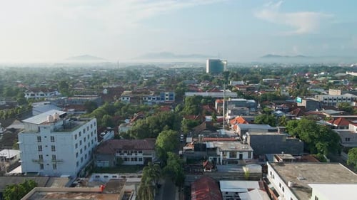 Drone footage of a developed town, showcasing the density of buildings and residential areas in the
