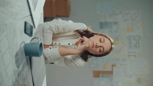 Vertical Video Portrait of a Female Architect Researching New Materials