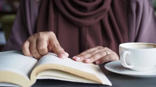Women Hand Reading a Book at Library